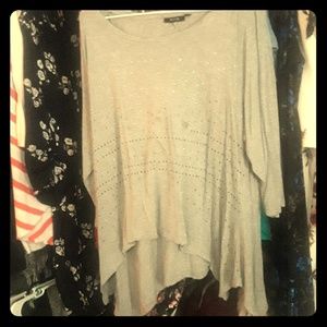 A grey blouse with rhinestones